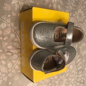 New with tags,  silver Mary Jane shoes.